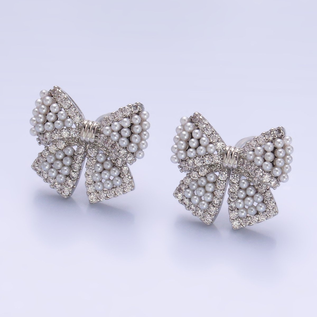 24K Gold Filled Shell Pearl Dotted Micro Paved CZ Ribbon Bow Stud Earrings in Gold & Silver | AB692 AB693 - DLUXCA