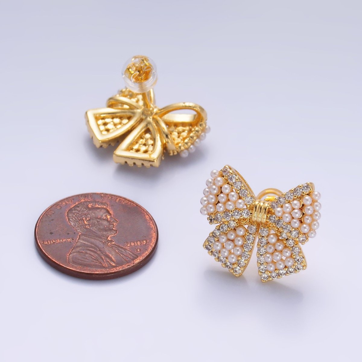 24K Gold Filled Shell Pearl Dotted Micro Paved CZ Ribbon Bow Stud Earrings in Gold & Silver | AB692 AB693 - DLUXCA