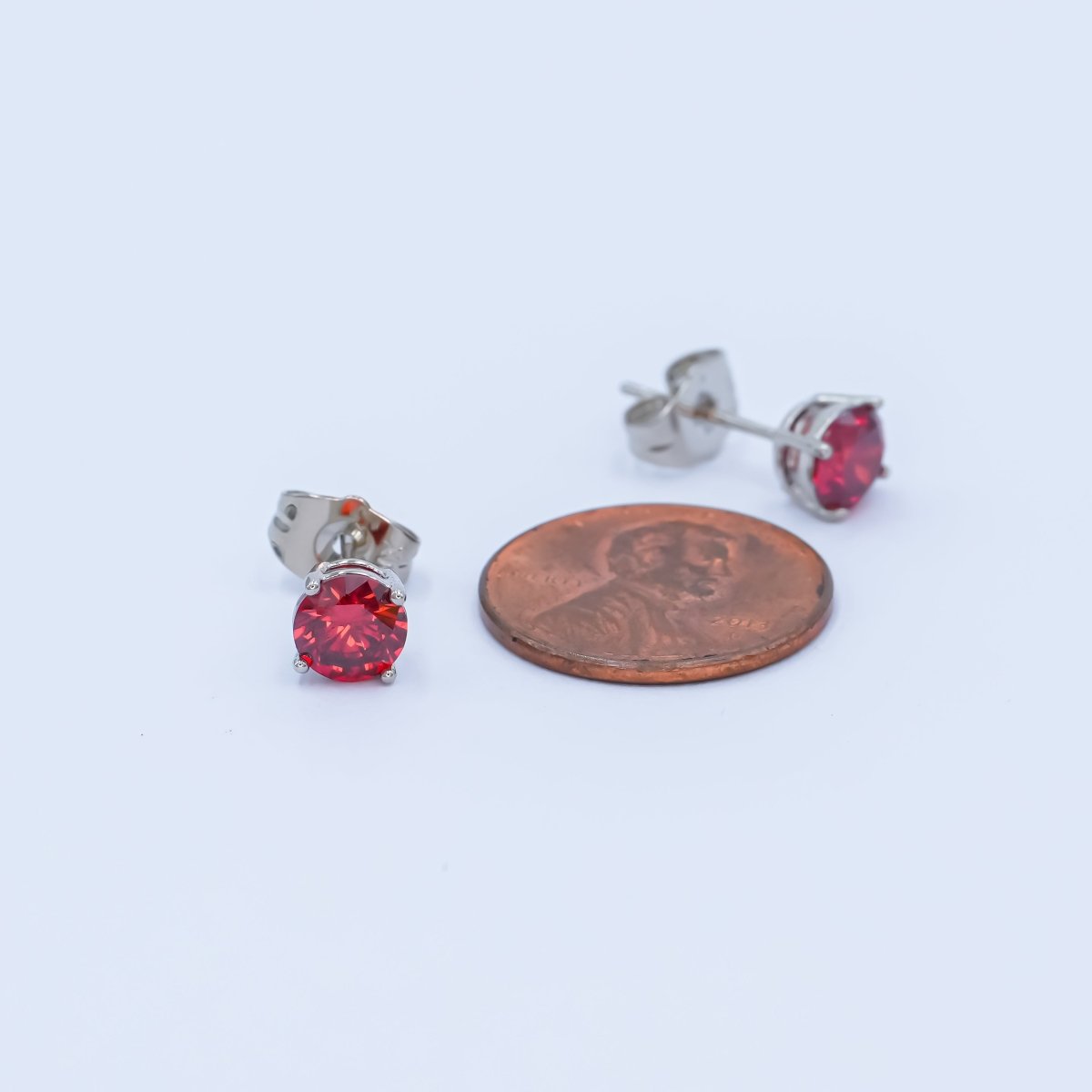 Rhodium Plated 6mm Red Round CZ Stud Earrings | AB1075 - DLUXCA