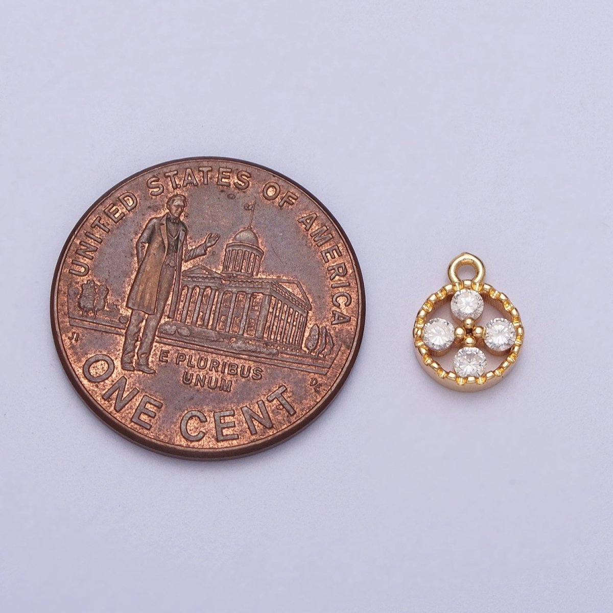 Mini Clear Cubic Zirconia Quatrefoil Open Round Gold Charm E-512 - DLUXCA