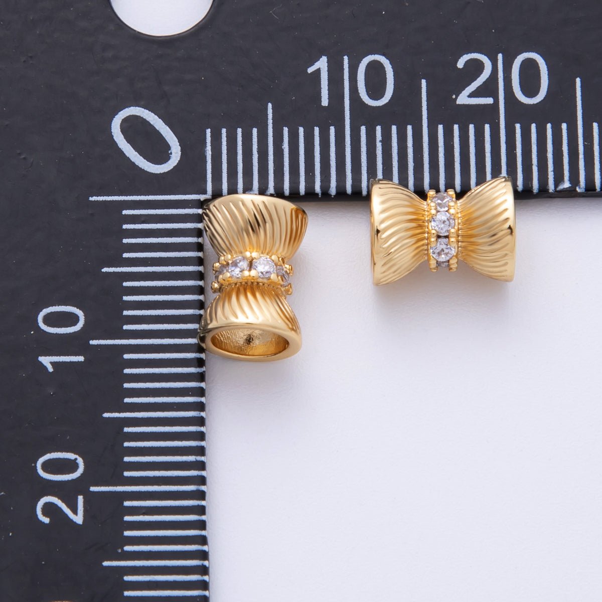 14k Gold Filled 9mm Clear CZ Ribbon Bow Textured Spacer Beads | Beads - 200004 - DLUXCA