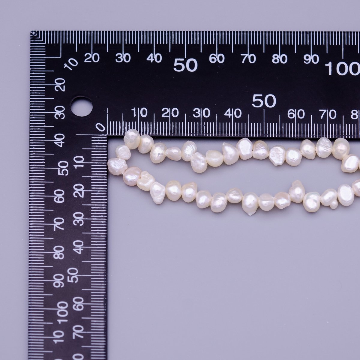 6.7mm - 7.6mm Nugget Seed White Natural Freshwater Pearl 71pcs Full Strand | WA-1317 Clearance Pricing - DLUXCA