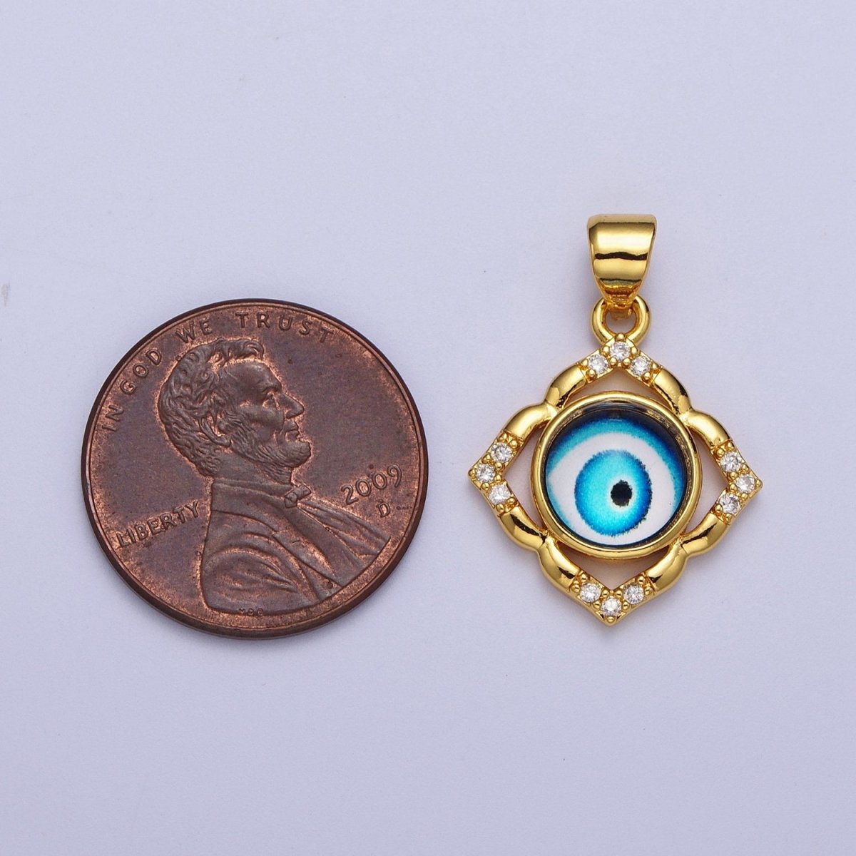 Bright Blue Evil Eye Gold Floral Patterned Pendant, 24K Gold Filled Blue Hypnotic Eye of Ra Clear Micro Paved CZ Florette Charm | X-685 - DLUXCA