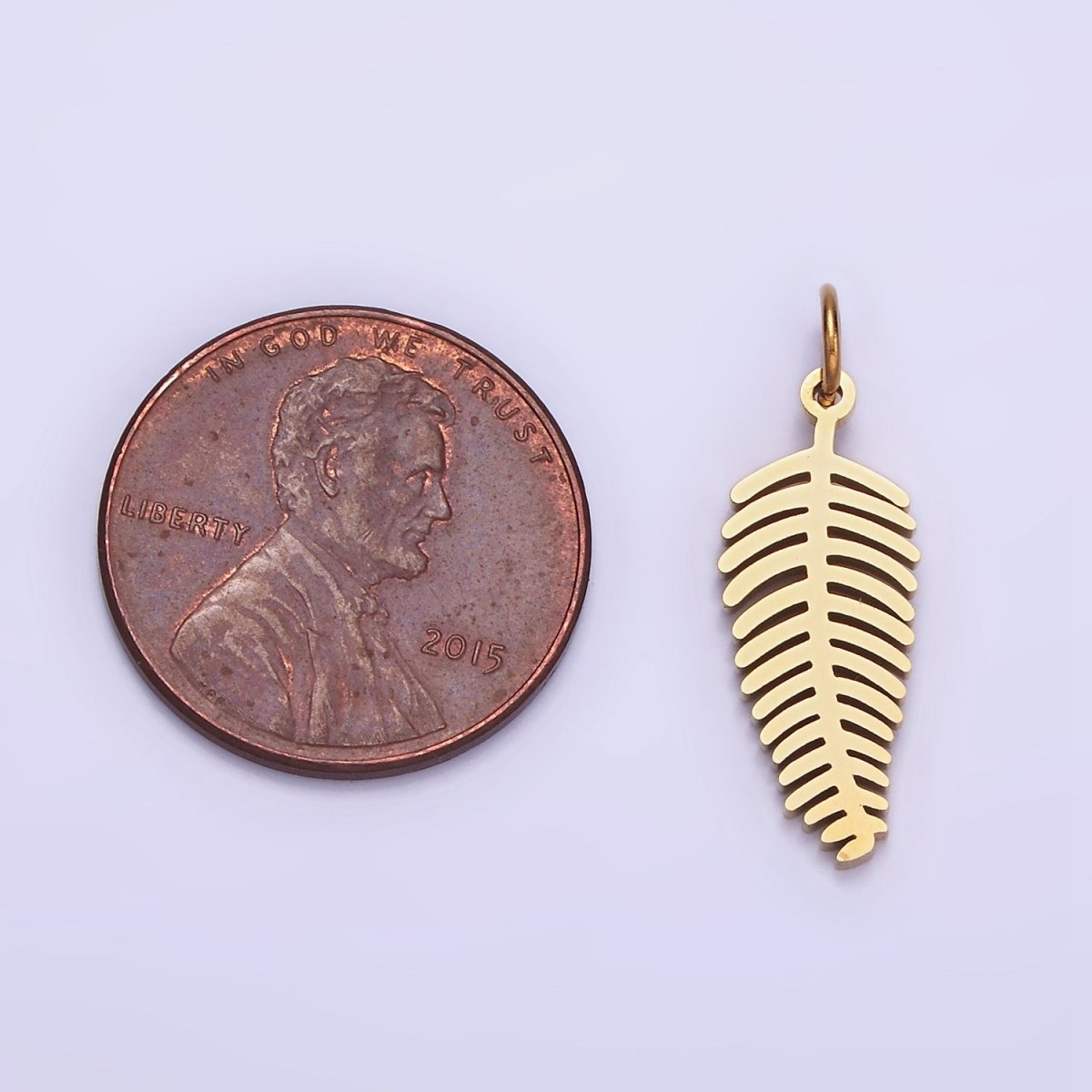 Dainty Gold Palm Tree Leaf Charm in Stainless Steel P-1400 - DLUXCA